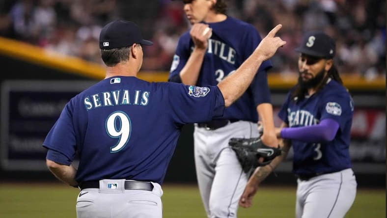 Jul 28, 2023; Phoenix, Arizona, USA; Seattle Mariners manager Scott Servais (9) walks to the mound to remove Seattle Mariners starting pitcher Logan Gilbert (36) from the game against the Arizona Diamondbacks as Seattle Mariners shortstop J.P. Crawford (3) looks on during the seventh inning at Chase Field. Mandatory Credit: Joe Camporeale-USA TODAY Sports