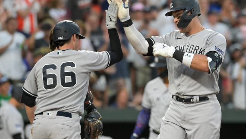 Jul 29, 2023; Baltimore, Maryland, USA;  New York Yankees right fielder Aaron Judge (99) celebrates with catcher Kyle Higashioka (66) at home plate after hitting a two run home run in the third inning against the Baltimore Orioles at Oriole Park at Camden Yards. Mandatory Credit: Tommy Gilligan-USA TODAY Sports