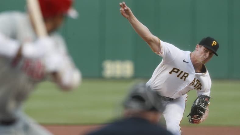 Jul 29, 2023; Pittsburgh, Pennsylvania, USA; Pittsburgh Pirates starting pitcher Quinn Priester (64) throws to Philadelphia Phillies right fielder Nick Castellanos (8) during the third inning at PNC Park. Mandatory Credit: Charles LeClaire-USA TODAY Sports