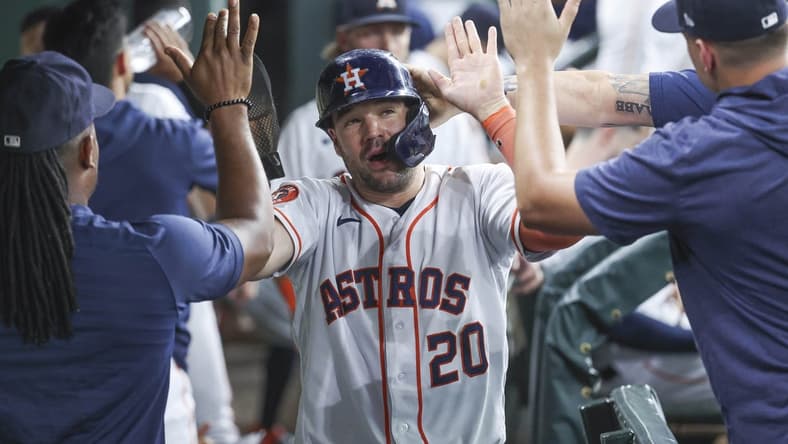 Jul 29, 2023; Houston, Texas, USA; Houston Astros designated hitter Chas McCormick (20) is congratulated after scoring during the fifth inning against the Tampa Bay Rays at Minute Maid Park. Mandatory Credit: Troy Taormina-USA TODAY Sports