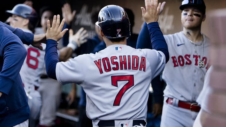 Jul 29, 2023; San Francisco, California, USA;  Boston Red Sox left fielder Masataka Yoshida (7) celebrates in the dugout after scoring against the San Francisco Giants during the ninth inning at Oracle Park. Mandatory Credit: John Hefti-USA TODAY Sports