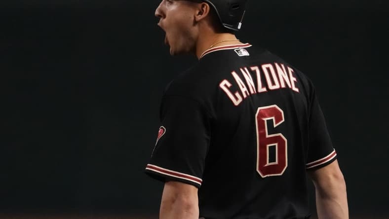 Jul 29, 2023; Phoenix, Arizona, USA; Arizona Diamondbacks designated hitter Dominic Canzone (6) reacts after hitting an RBI single against the Seattle Mariners during the eighth inning at Chase Field. Mandatory Credit: Joe Camporeale-USA TODAY Sports