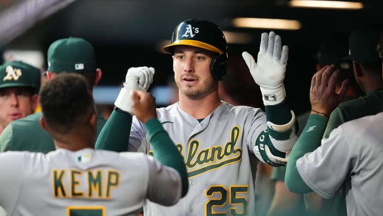 Jul 29, 2023; Denver, Colorado, USA; Oakland Athletics designated hitter Brent Rooker (25) following his sacrifice fly scoring run in the sixth inning against the Colorado Rockies at Coors Field. Mandatory Credit: Ron Chenoy-USA TODAY Sports
