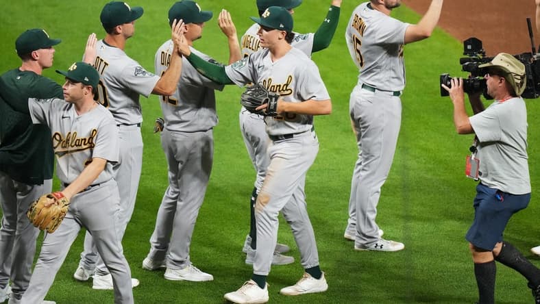 Jul 29, 2023; Denver, Colorado, USA; Oakland Athletics second baseman Zack Gelof (20) celebrates after defeating the Colorado Rockies at Coors Field. Mandatory Credit: Ron Chenoy-USA TODAY Sports