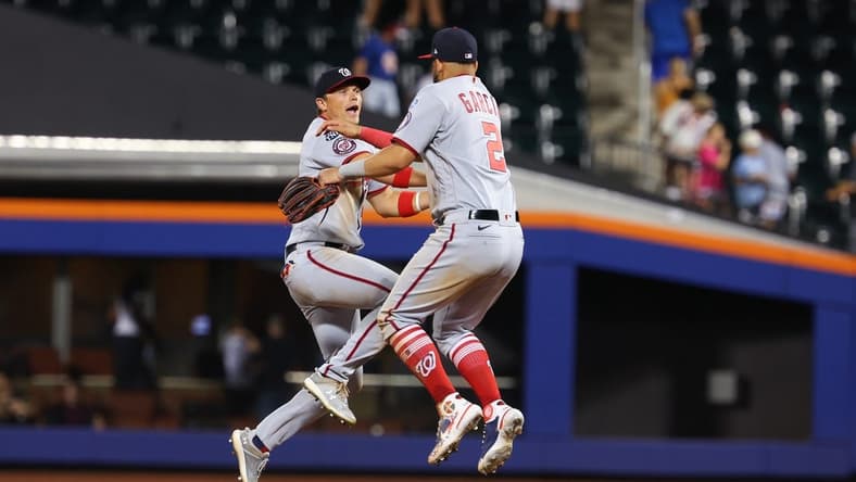 Jul 29, 2023; New York City, New York, USA; Washington Nationals center fielder Alex Call (17) celebrates with second baseman Luis Garcia (2) after defeating the New York Mets at Citi Field. Mandatory Credit: Vincent Carchietta-USA TODAY Sports