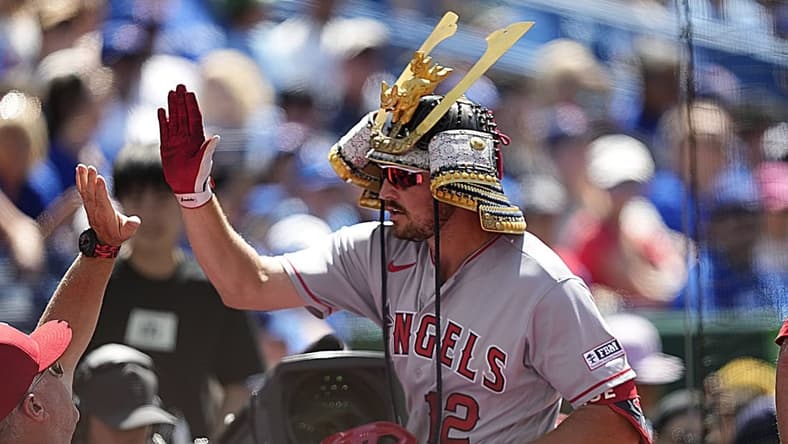Jul 30, 2023; Toronto, Ontario, CAN; Los Angeles Angels right fielder Hunter Renfroe (12) celebrates with teammates after hitting a two run home run against the Toronto Blue Jays during the tenth inning at Rogers Centre. Mandatory Credit: John E. Sokolowski-USA TODAY Sports