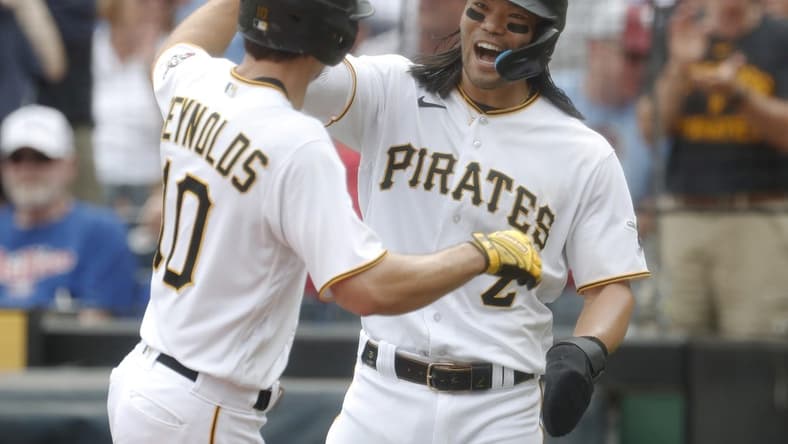 Jul 30, 2023; Pittsburgh, Pennsylvania, USA; Pittsburgh Pirates right fielder Connor Joe (2) congratulates left fielder Bryan Reynolds (10) after Reynolds hit a two run home run against the /phil/ during the sixth inning at PNC Park. Mandatory Credit: Charles LeClaire-USA TODAY Sports
