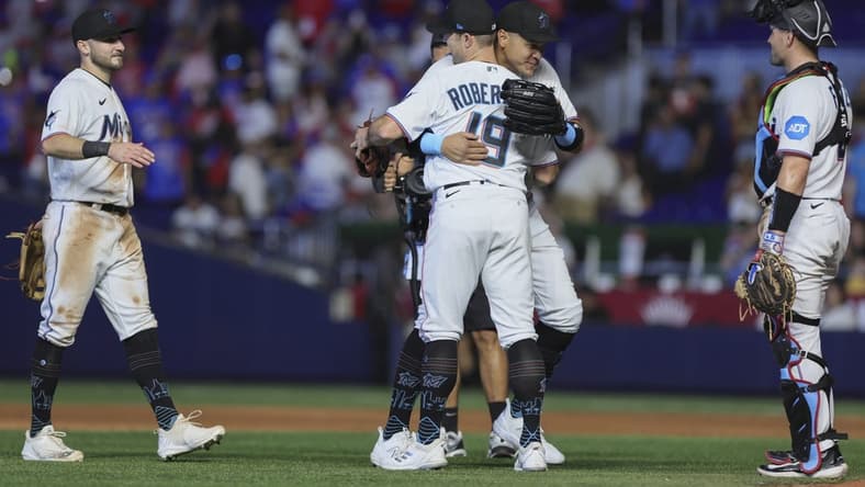 Jul 30, 2023; Miami, Florida, USA; Miami Marlins right fielder Avisail Garcia (24) celebrates with relief pitcher David Robertson (19) after defeating the Detroit Tigers at loanDepot Park. Mandatory Credit: Sam Navarro-USA TODAY Sports