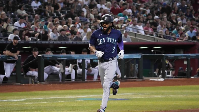 Jul 30, 2023; Phoenix, Arizona, USA; Seattle Mariners shortstop J.P. Crawford (3) runs the bases after hitting a solo home run against the Arizona Diamondbacks during the second inning at Chase Field. Mandatory Credit: Joe Camporeale-USA TODAY Sports