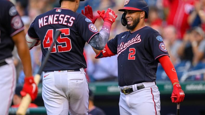 Jul 31, 2023; Washington, District of Columbia, USA; Washington Nationals designated hitter Joey Meneses (45) celebrates with Washington Nationals second baseman Luis Garcia (2) after hitting a home run during the second inning against the Milwaukee Brewers at Nationals Park. Mandatory Credit: Reggie Hildred-USA TODAY Sports