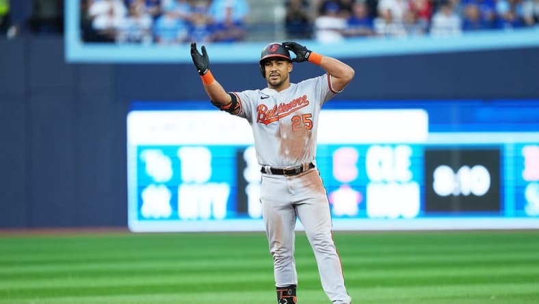 Jul 31, 2023; Toronto, Ontario, CAN; Baltimore Orioles right fielder Anthony Santander (25) celebrates hitting a double against the Toronto Blue Jays during the third inning at Rogers Centre. Mandatory Credit: Nick Turchiaro-USA TODAY Sports