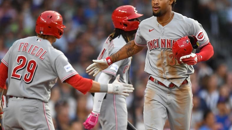 Jul 31, 2023; Chicago, Illinois, USA; Cincinnati Reds left fielder Will Benson (30) celebrates after scoring during the second inning against the Chicago Cubs at Wrigley Field. Mandatory Credit: Patrick Gorski-USA TODAY Sports