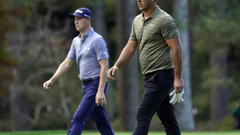 Nov 13, 2020; Augusta, Georgia, USA; Brooks Koepka and Justin Thomas walk up the 14th fairway during the second round of The Masters golf tournament at Augusta National GC. Mandatory Credit: Rob Schumacher-USA TODAY Sports