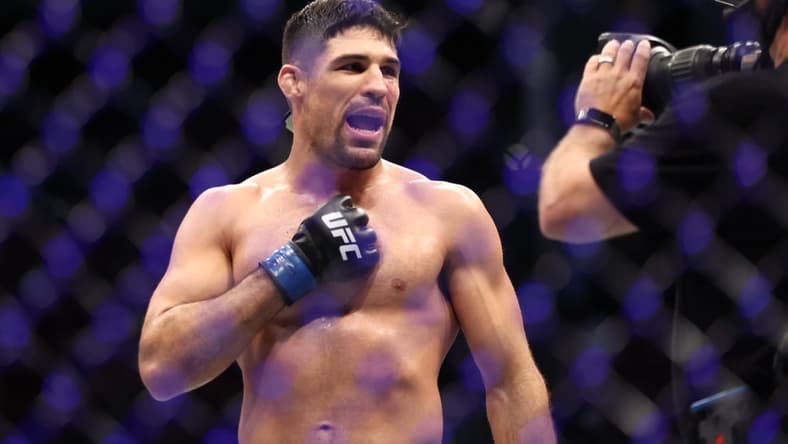 Aug 7, 2021; Houston, Texas, USA; Vicente Luque (blue gloves) reacts to the fight against Michael Chiesa (red gloves) during UFC 265 at Toyota Center. Mandatory Credit: Troy Taormina-USA TODAY Sports