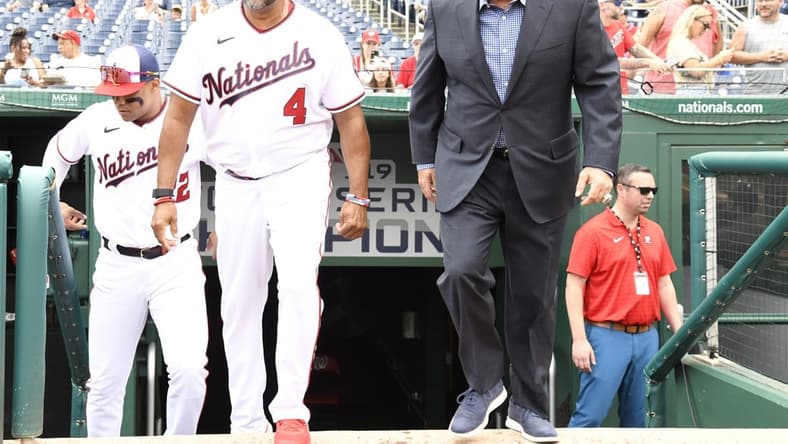 Jul 17, 2022; Washington, District of Columbia, USA;  Washington Nationals manager Dave Martinez (4) and general manager Mike Rizzo (right) step onto the field for a pre-game ceremony at Nationals Park. Mandatory Credit: James A. Pittman-USA TODAY Sports