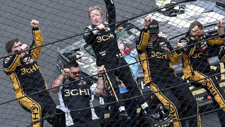 NASCAR Cup Series driver Tyler Reddick (8) and his team climb the fence Sunday, July 31, 2022, after winning the Verizon 200 at the Brickyard at Indianapolis Motor Speedway.

MAIN IMAGE 073122 Nascarverizon200 0027