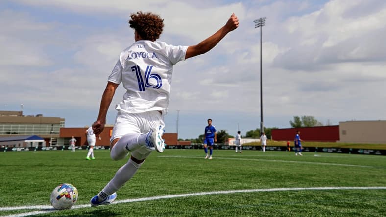 Aug 10, 2022; Blaine, MN, USA; MLS Next East player Favian Loyola (16) of Orlando City takes a corner kick against MLS Next West during the second half of the 2022 MLS NEXT All-Star Game at National Sports Center Indoor Sports Hall. Mandatory Credit: Kirby Lee-USA TODAY Sports