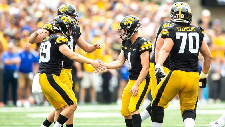 Iowa placekicker Aaron Blom (1) celebrates with longsnapper Luke Elkin, left, and holder Tory Taylor during a NCAA football game against South Dakota State, Saturday, Sept. 3, 2022, at Kinnick Stadium in Iowa City, Iowa.
220903 Sdsu Iowa Fb 020 Jpg