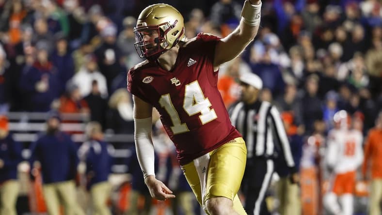 Nov 26, 2022; Chestnut Hill, Massachusetts, USA; Boston College Eagles quarterback Emmett Morehead (14) celebrates a touchdown against the Syracuse Orange during the first quarter at Alumni Stadium. Mandatory Credit: Winslow Townson-USA TODAY Sports