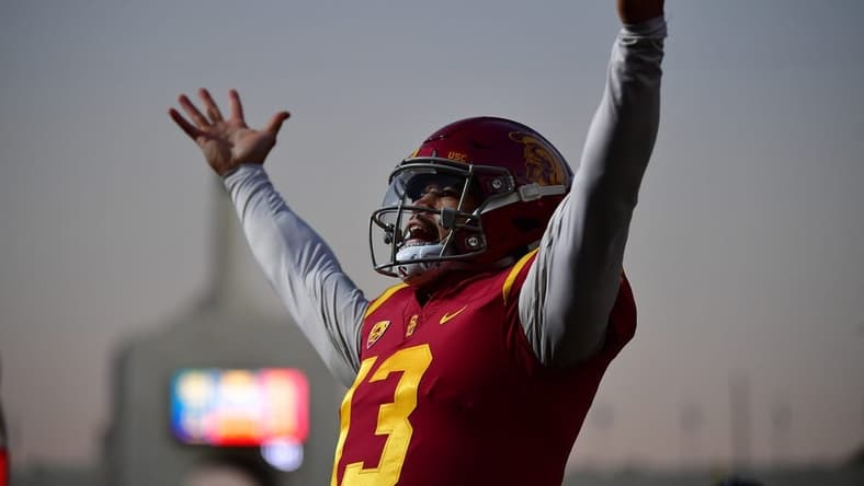 Southern California Trojans quarterback Caleb Williams (13) celebrates Tahj Washington (16) scoring a touchdown against the Notre Dame Fighting Irish during the first half at the Los Angeles Memorial Coliseum. Mandatory Credit: Gary A. Vasquez-USA TODAY Sports