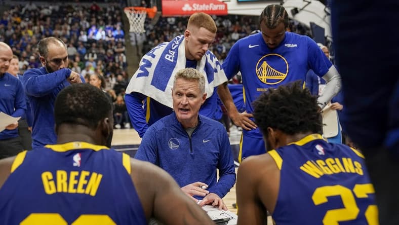Nov 27, 2022; Minneapolis, Minnesota, USA; Golden State Warriors head coach Steve Kerr talks to his players during a timeout against the Minnesota Timberwolves in the second quarter at Target Center. Mandatory Credit: Nick Wosika-USA TODAY Sports
