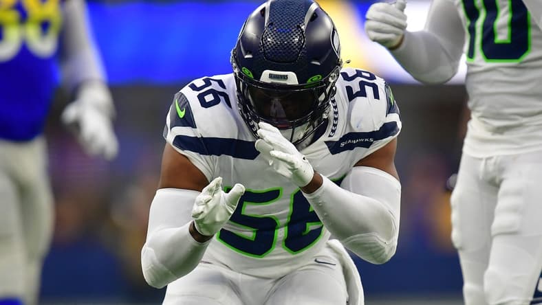 Dec 4, 2022; Inglewood, California, USA; Seattle Seahawks linebacker Jordyn Brooks (56) reacts after sacking Los Angeles Rams quarterback John Wolford (13) during the second half at SoFi Stadium. Mandatory Credit: Gary A. Vasquez-USA TODAY Sports