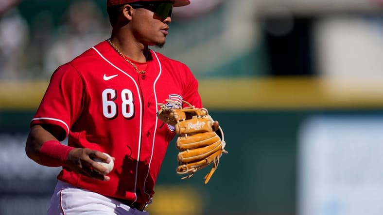 Cincinnati Reds shortstop Noelvi Marte (68) plays a ground ball off the bat of Cleveland Guardians Jhonkensy Noel in the sixth inning of the MLB Cactus League spring training game between the Cincinnati Reds and the Cleveland Guardians at Goodyear Ballpark in Goodyear, Ariz., on Saturday, Feb. 25, 2023.

Cleveland Guardians At Cincinnati Reds Spring Training