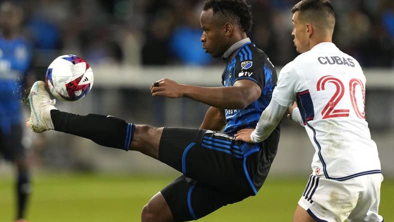 Mar 4, 2023; San Jose, California, USA; San Jose Earthquakes forward Jeremy Ebobisse (11) controls the ball against Vancouver Whitecaps midfielder Andres Cubas (20) during the second half at PayPal Park. Mandatory Credit: Darren Yamashita-USA TODAY Sports