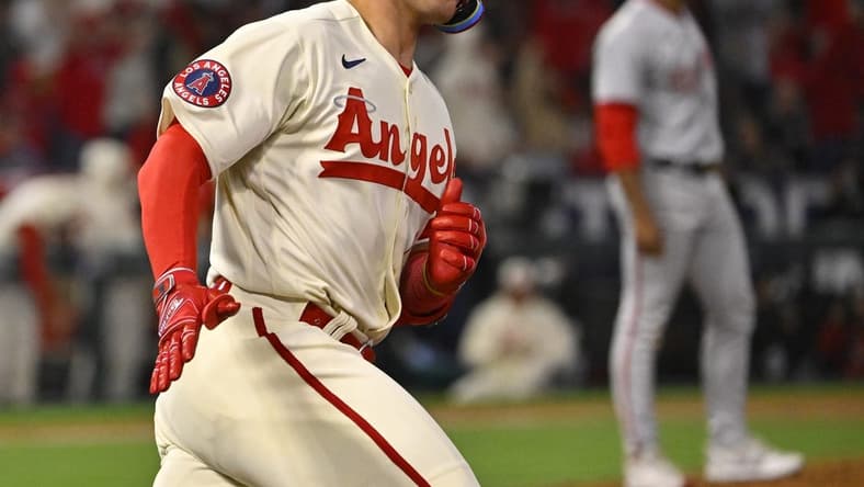 Apr 11, 2023; Anaheim, California, USA; Los Angeles Angels catcher Logan O'Hoppe (14) heads to first on a solo home run in the sixth inning against the Washington Nationals at Angel Stadium. Mandatory Credit: Jayne Kamin-Oncea-USA TODAY Sports
