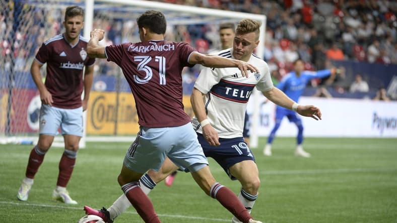 Apr 29, 2023; Vancouver, British Columbia, CAN; Vancouver Whitecaps FC midfielder Julian Gressel (19) defends against Colorado Rapids defender Anthony Markanich (31) during the second half at BC Place. Mandatory Credit: Anne-Marie Sorvin-USA TODAY Sports