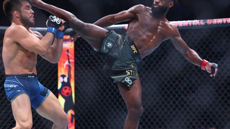 May 6, 2023; Newark, New Jersey, USA; Aljamain Sterling (red gloves) fights Henry Cejudo (blue gloves) during UFC 288 at Prudential Center. Mandatory Credit: Ed Mulholland-USA TODAY Sports