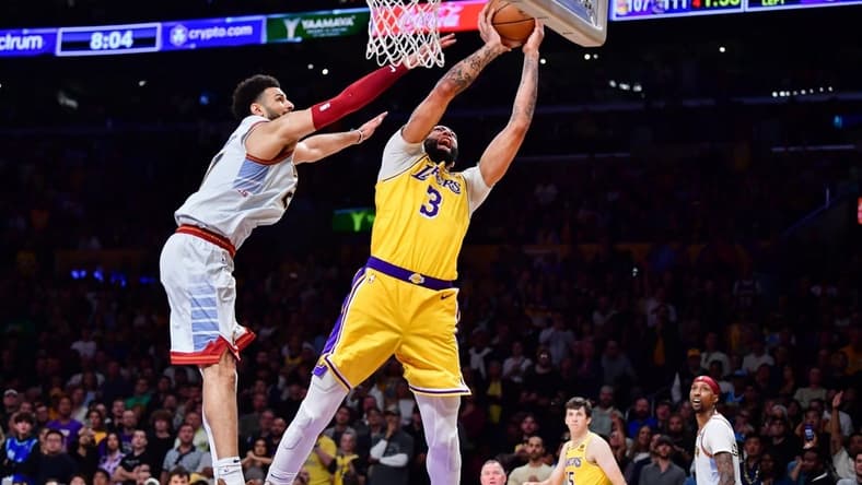 May 22, 2023; Los Angeles, California, USA; Los Angeles Lakers forward Anthony Davis (3) is fouled by Denver Nuggets guard Jamal Murray (27) during the fourth quarter in game four of the Western Conference Finals for the 2023 NBA playoffs at Crypto.com Arena. Mandatory Credit: Gary A. Vasquez-USA TODAY Sports