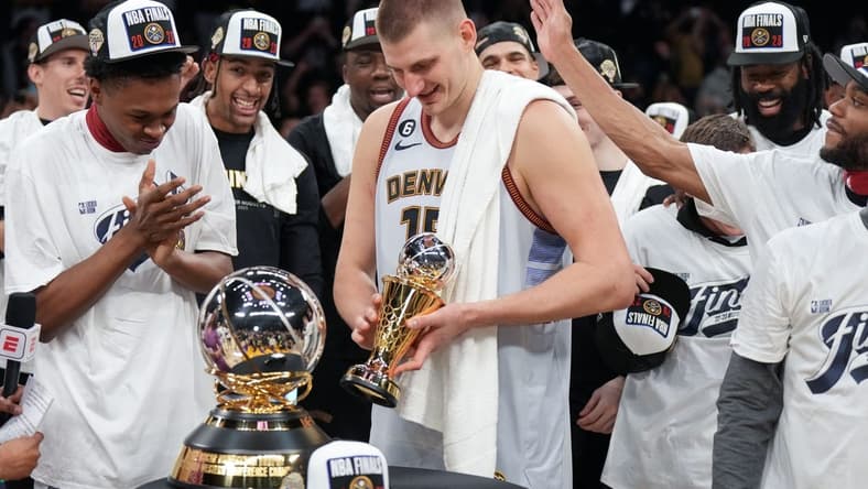 May 22, 2023; Los Angeles, California, USA; Denver Nuggets center Nikola Jokic (15) celebrates winning the Western Conference MVP Trophy and beating the Los Angeles Lakers in game four of the Western Conference Finals for the 2023 NBA playoffs at Crypto.com Arena. Mandatory Credit: Kirby Lee-USA TODAY Sports