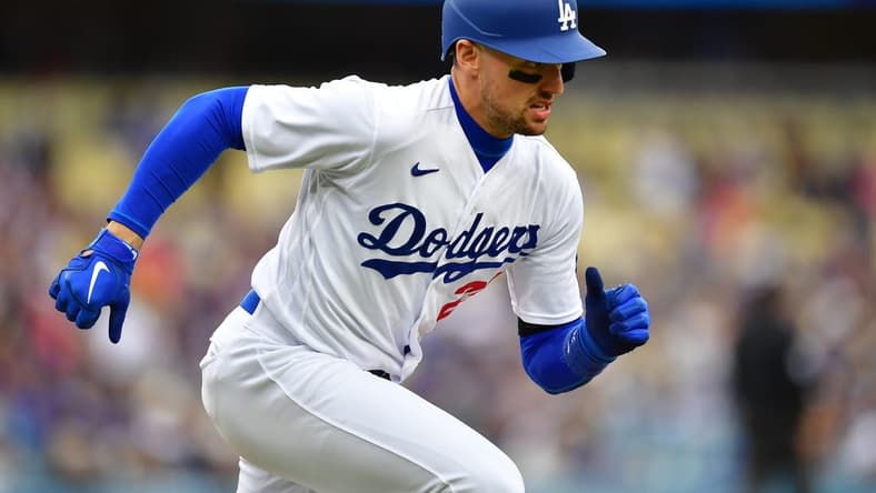 May 31, 2023; Los Angeles, California, USA; Los Angeles Dodgers center fielder Trayce Thompson (25) runs after hitting a single against the Washington Nationals during the fourth inning at Dodger Stadium. Mandatory Credit: Gary A. Vasquez-USA TODAY Sports