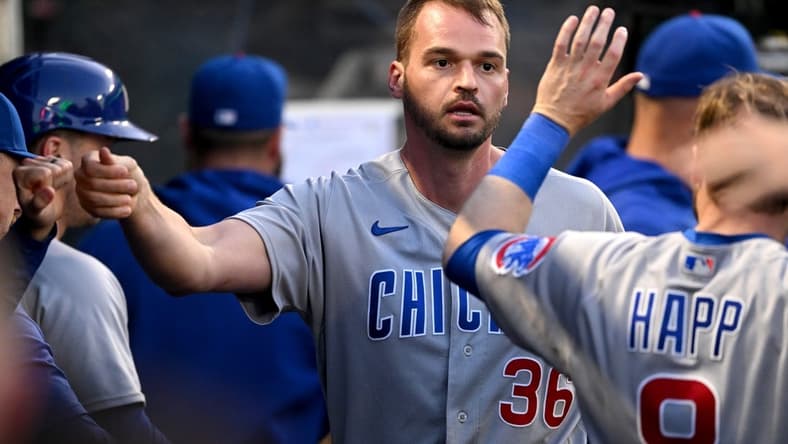 Jun 7, 2023; Anaheim, California, USA;  Chicago Cubs first baseman Trey Mancini (36) is greeted in the dugout after an RBI double and scoring a run in the fifth inning against the Los Angeles Angels at Angel Stadium. Mandatory Credit: Jayne Kamin-Oncea-USA TODAY Sports