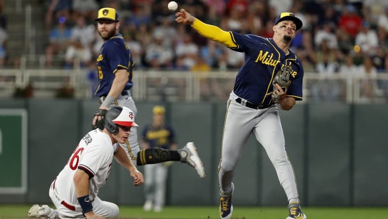 Jun 13, 2023; Minneapolis, Minnesota, USA; Milwaukee Brewers second baseman Luis Urias (2) forces out Minnesota Twins pinch hitter Max Kepler (26) but cannot turn the double play in the eighth inning at Target Field. Mandatory Credit: Bruce Kluckhohn-USA TODAY Sports