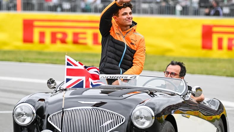 Jun 18, 2023; Montreal, Quebec, CAN; McLaren driver Lando Norris (GBR) parades and salutes the crowd before the Canadian Grand Prix at Circuit Gilles Villeneuve. Mandatory Credit: David Kirouac-USA TODAY Sports