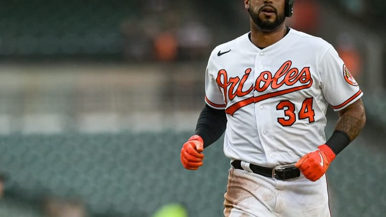 Jun 27, 2023; Baltimore, Maryland, USA;  Baltimore Orioles left fielder Aaron Hicks (34) scores on  right fielder Ryan McKenna (not pictured) second inning sacrifice fly Cincinnati Reds  at Oriole Park at Camden Yards. Mandatory Credit: Tommy Gilligan-USA TODAY Sports