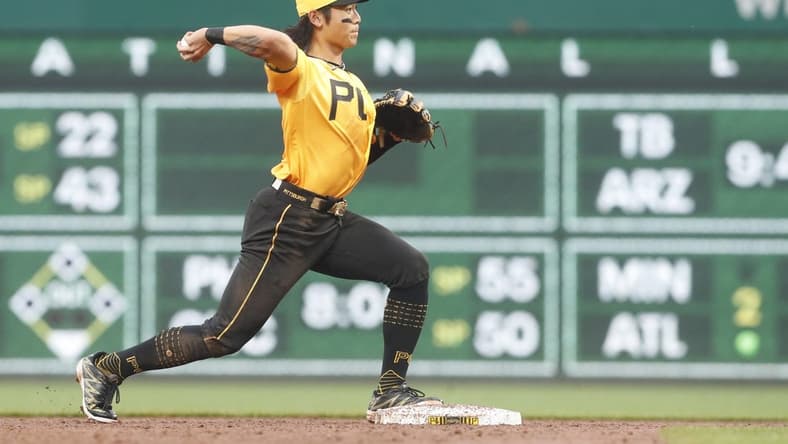 Jun 27, 2023; Pittsburgh, Pennsylvania, USA;  Pittsburgh Pirates center fielder Ji Hwan Bae (3) throws to first base to complete a double play against the San Diego Padres during the third inning at PNC Park. Mandatory Credit: Charles LeClaire-USA TODAY Sports