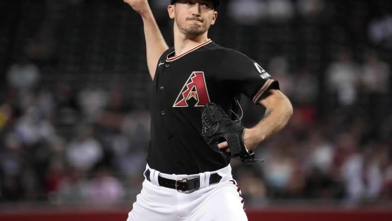 Jun 28, 2023; Phoenix, Arizona, USA; Arizona Diamondbacks starting pitcher Zach Davies (27) pitches against the Tampa Bay Rays during the third inning at Chase Field. Mandatory Credit: Joe Camporeale-USA TODAY Sports