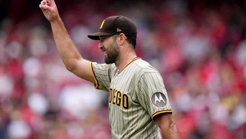 San Diego Padres starting pitcher Michael Wacha (52) gestures toward San Diego Padres center fielder Trent Grisham (1) after completing a catch in the second inning during a baseball game between the San Diego Padres and the Cincinnati Reds, Saturday, July 1, 2023, at Great American Ball Park in Cincinnati.