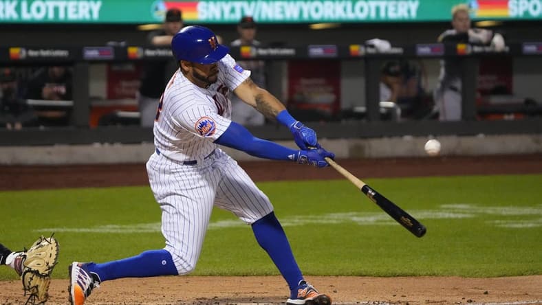 Jul 2, 2023; New York City, New York, USA; New York Mets left fielder Tommy Pham (28) hits an RBI double against the San Francisco Giants during the fourth inning at Citi Field. Mandatory Credit: Gregory Fisher-USA TODAY Sports