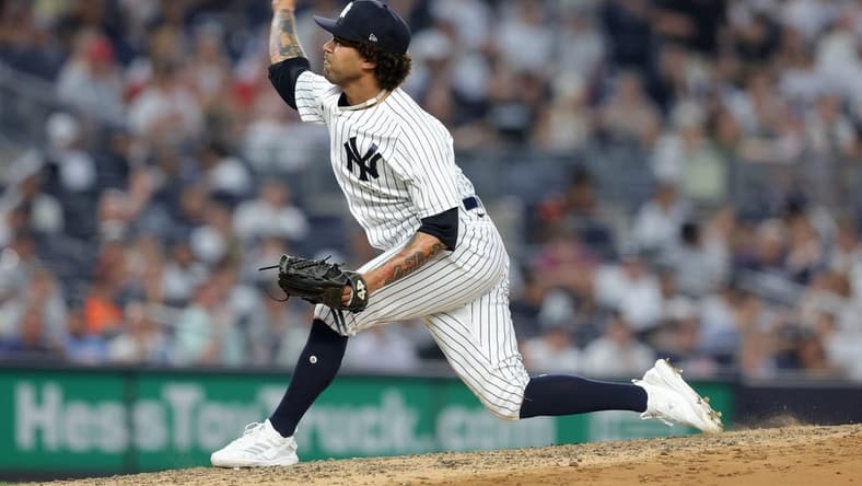 Jul 6, 2023; Bronx, New York, USA; New York Yankees relief pitcher Deivi Garcia (83) pitches against the Baltimore Orioles during the fourth inning at Yankee Stadium. Mandatory Credit: Brad Penner-USA TODAY Sports