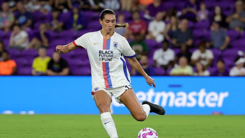 Jul 7, 2023; Orlando, Florida, USA; OL Reign midfielder Olivia Van der Jagt (33) kicks the ball against the Orlando Pride during the second half at Exploria Stadium. Mandatory Credit: Mike Watters-USA TODAY Sports