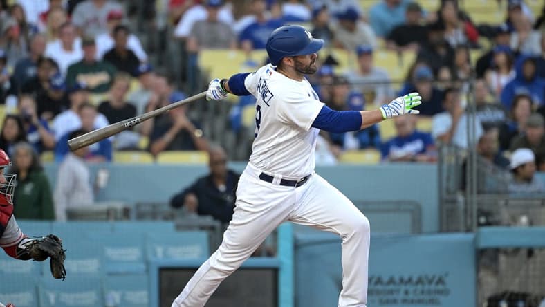 Jul 7, 2023; Los Angeles, California, USA; Los Angeles Dodgers designated hitter J.D. Martinez (28) hits a solo home run in the second inning against the Los Angeles Angels at Dodger Stadium. Mandatory Credit: Jayne Kamin-Oncea-USA TODAY Sports