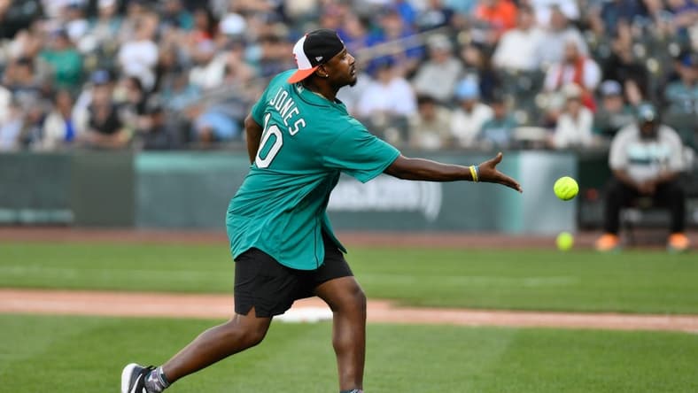 Jul 8, 2023; Seattle, Washington, USA; Former MLB All-Star Adam Jones pitches during the All-Star Celebrity Game at T-Mobile Park. Mandatory Credit: Steven Bisig-USA TODAY Sports