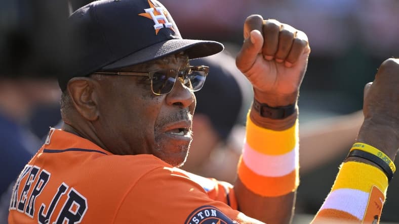Jul 16, 2023; Anaheim, California, USA; Houston Astros manager Dusty Baker Jr. (12) gives signs from the dugout in the fifth inning against the Los Angeles Angels at Angel Stadium. Mandatory Credit: Jayne Kamin-Oncea-USA TODAY Sports