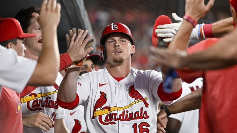 Jul 17, 2023; St. Louis, Missouri, USA;  St. Louis Cardinals pinch hitter Nolan Gorman (16) is congratulated by teammates after scoring against the Miami Marlins during the sixth inning at Busch Stadium. Mandatory Credit: Jeff Curry-USA TODAY Sports