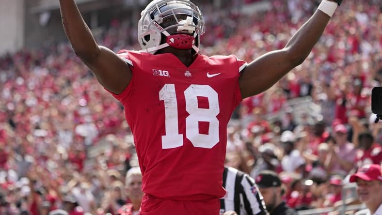 September 10, 2022; Columbus, Ohio, USA; Ohio State Buckeyes wide receiver Marvin Harrison Jr. (18) celebrates after scoring a touchdown during the second half of Saturday's game against the Arkansas State Red Wolves at Ohio Stadium.Mandatory Credit: Barbara J. Perenic/Columbus Dispatch