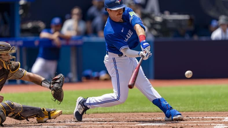 Jul 20, 2023; Toronto, Ontario, CAN; Toronto Blue Jays left fielder Jordan Luplow (7) hits a RBI single against the San Diego Padres during the second inning at Rogers Centre. Mandatory Credit: Kevin Sousa-USA TODAY Sports